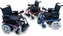 picture of three power wheelchairs