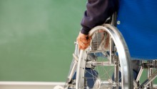 back view of individual in a manual wheelchair