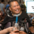Two smiling people, one of them in a wheelchair, cheer beer with others in a restaurant. In an outlined box, the Where it's AT logo sits above text that reads - Accessibility AT Restaurants, AbilityTools.org.