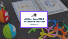A black tablecloth with colorful magnetic men, a white picture book and small round multicolored animals. Below the Where It's AT logo, text reads "Abilities Expo 2024 LAtest and GreATest - AbilityTools.org"
