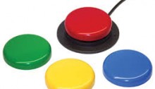 picture of four circlular switches, red green, yellow and blue and the red is attached to a black cord