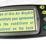 picture of a small handheld magnifier with large text printed on a yellow background