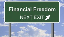 Picture of street sign that says "financial Freedom next exit"