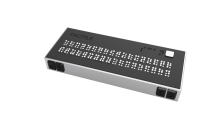 black rectangular device with many retractable white pins on top
