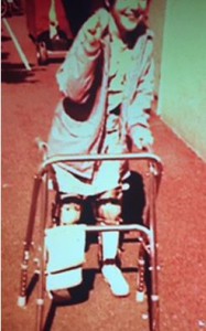 Christine as child using a walker with leg braces 