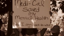 Women holding sign that states" Medi-cal saved my mental health. Now I am back to work"