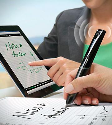 A person is writing with a smart pen, the text they are writing appears on a tablet screen.