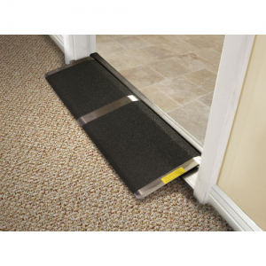 A black and aluminum threshold ramp in shown in a door way. 