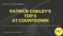 A black background with skyscraper buildings. The white text at the top reads "Ability Tools Weekly". The large gold text reads "Patrick Cokley's Top 5 AT Countdown". There is a gold line. The bottom left has small gold text with " HTTP://ABILITYTOOLS.ORG/BLOG/". The bottom right has a gold circle with the Ability Tools logo.