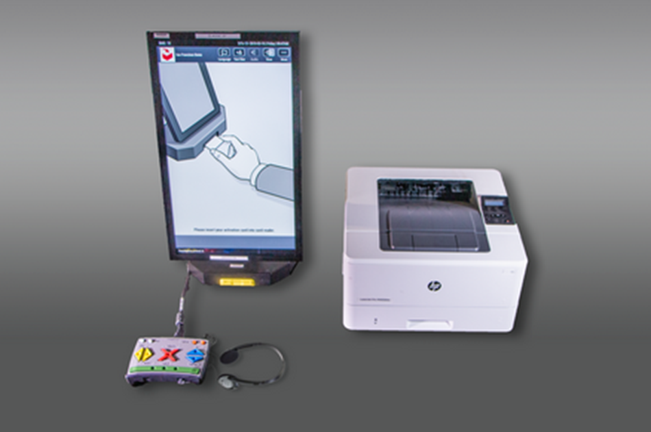 A Dominion ICX touchscreen voting machine with assistive technology input device and headphones.