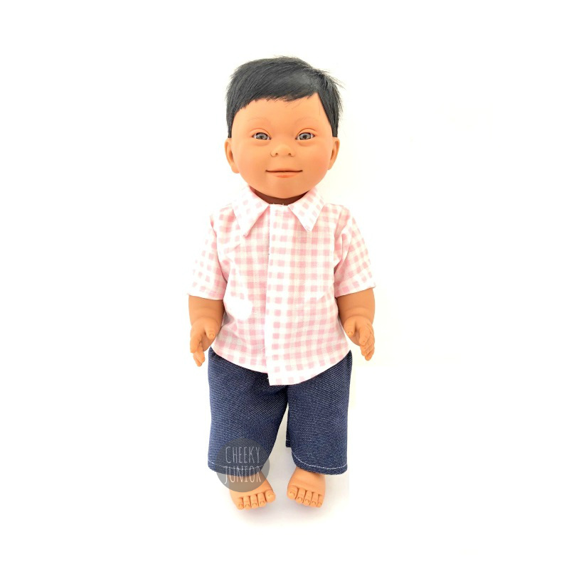 An Indian, male baby doll with Down syndrome.
