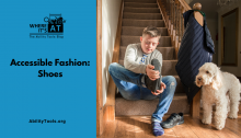 A young man with Down syndrome sits with a dog at the base of a staircase putting his shoes on. Under the Where it's AT logo, the text reads Accessible Fashion: Shoes - abilitytools.org